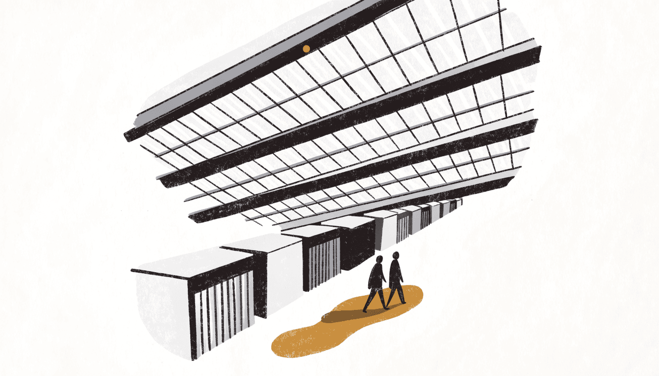 Silhouette figures walk past a row of small exhibition booths beneath a glass station roof.